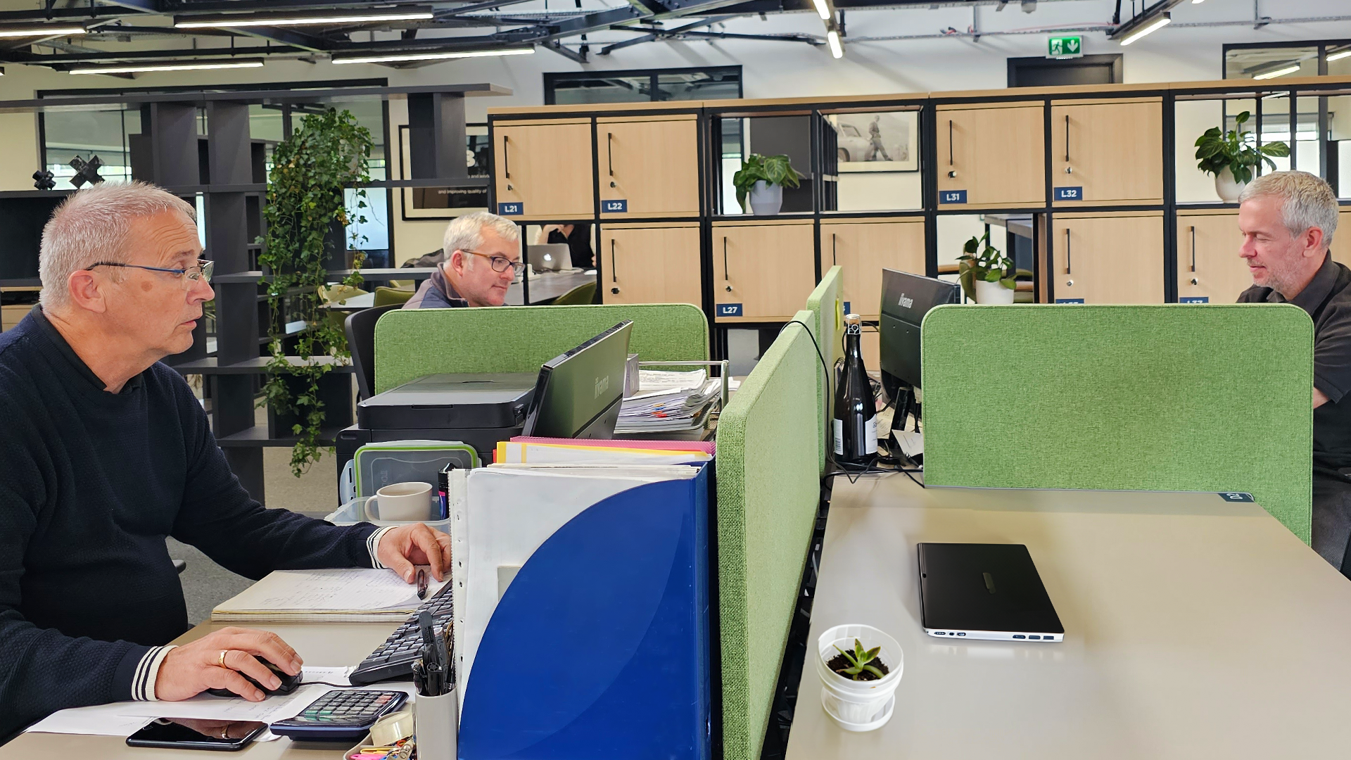 Winslade Park Co-working Members work together at their dedicated desks